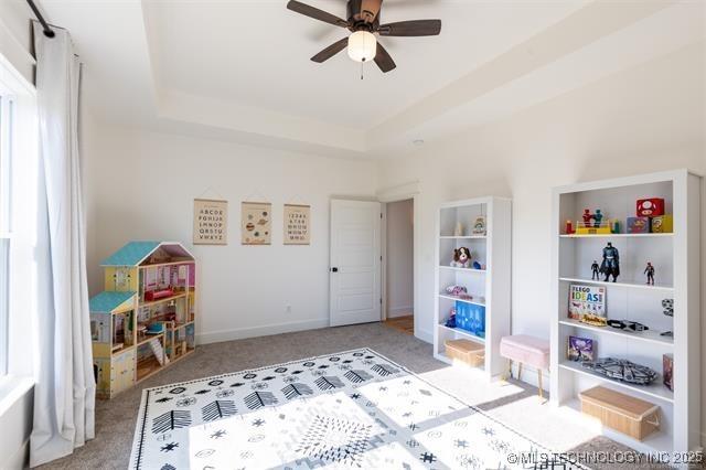 9520 N 144th Ave E, Owasso, OK 74055 - bedroom featuring carpet floors and a tray ceiling