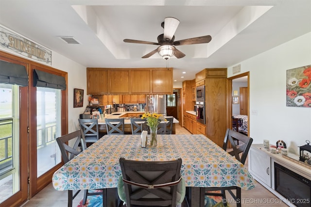 10495 S 426th Rd, Inola, OK 74036 - dining space with a ceiling fan, a raised ceiling, and recessed lighting