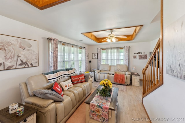 10495 S 426th Rd, Inola, OK 74036 - living room with a tray ceiling, stairway, wood finished floors, and ceiling fan