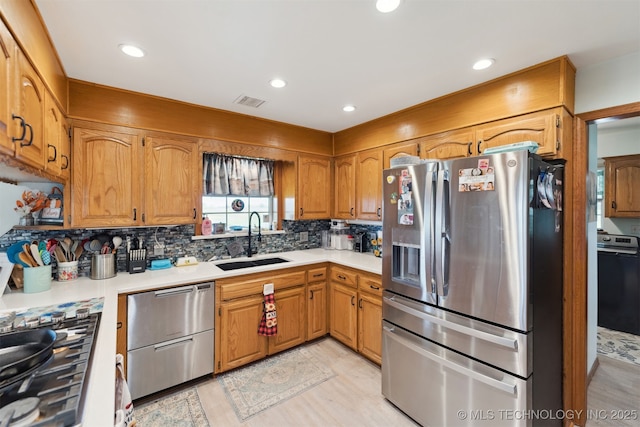10495 S 426th Rd, Inola, OK 74036 - kitchen with appliances with stainless steel finishes, light countertops, backsplash, recessed lighting, and light wood-style floors
