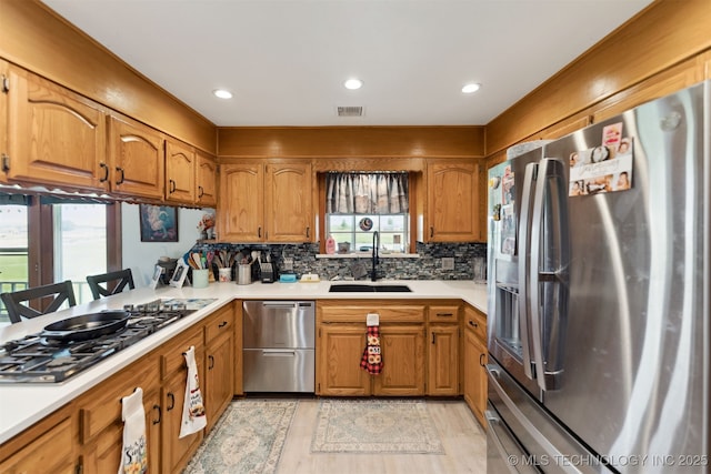 10495 S 426th Rd, Inola, OK 74036 - kitchen with appliances with stainless steel finishes, light countertops, brown cabinetry, and recessed lighting