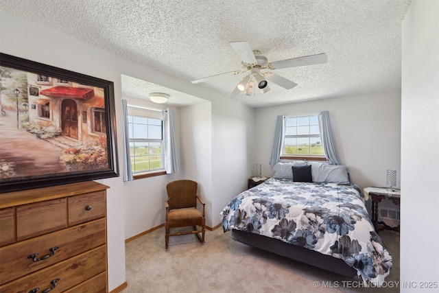 10495 S 426th Rd, Inola, OK 74036 - carpeted bedroom with a textured ceiling and a ceiling fan