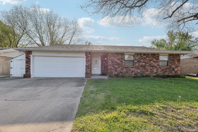 13973 S Hickory St, Glenpool, OK 74033 - single story home with brick siding, driveway, a front lawn, and a garage