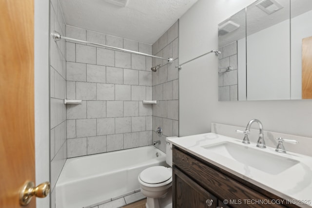 13973 S Hickory St, Glenpool, OK 74033 - bathroom with toilet, vanity, a textured ceiling, and visible vents