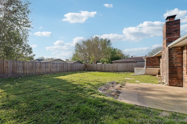 13973 S Hickory St, Glenpool, OK 74033 - view of yard with a fenced backyard and a patio