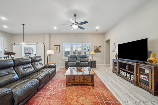 13010 E 125th Pl N, Collinsville, OK 74021 - living area with light wood-style flooring, ceiling fan, recessed lighting, and a barn door
