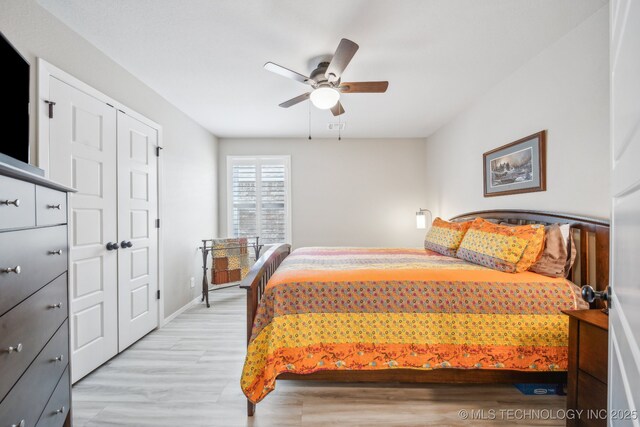 13010 E 125th Pl N, Collinsville, OK 74021 - bedroom featuring light wood-style floors and a ceiling fan