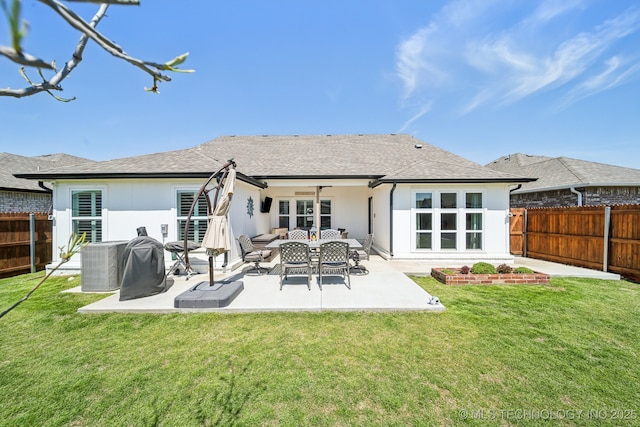 13010 E 125th Pl N, Collinsville, OK 74021 - rear view of house featuring a fenced backyard, a patio, a ceiling fan, and an outdoor hangout area