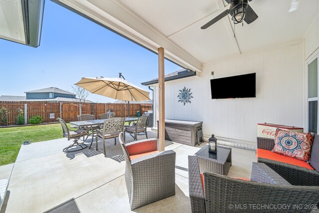 13010 E 125th Pl N, Collinsville, OK 74021 - fenced backyard featuring outdoor dining area, a ceiling fan, a patio, and an outdoor living space