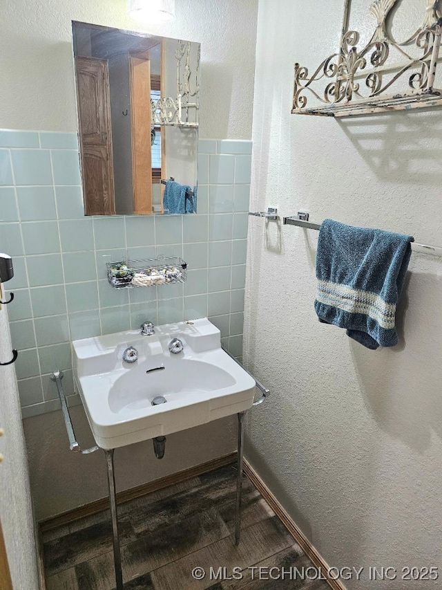 bathroom with tile walls