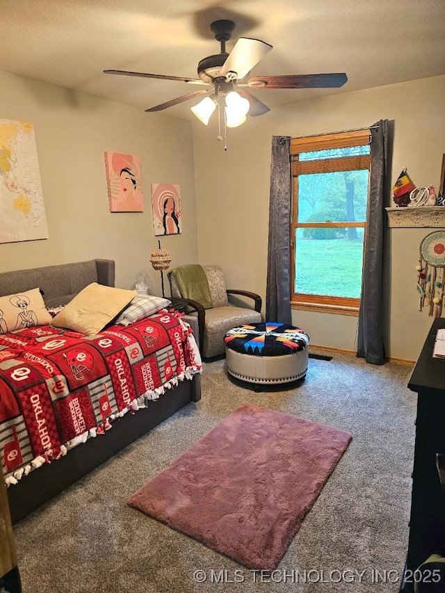 bedroom with a ceiling fan and carpet