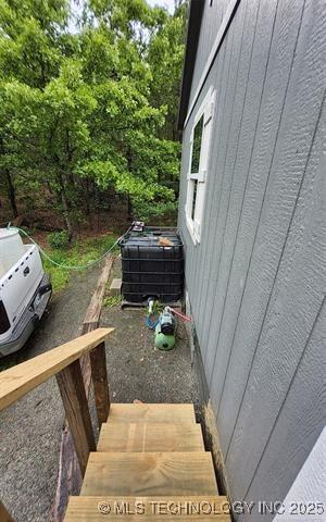 view of side of property with central AC unit