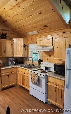 kitchen with a sink, wooden ceiling, light brown cabinetry, white appliances, and dark wood finished floors
