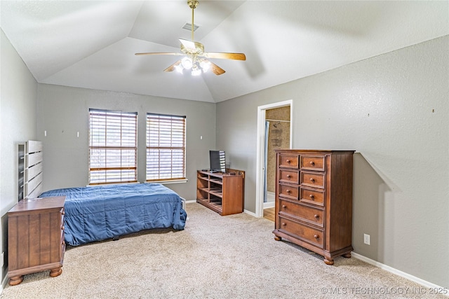 bedroom with lofted ceiling, visible vents, a ceiling fan, baseboards, and light colored carpet