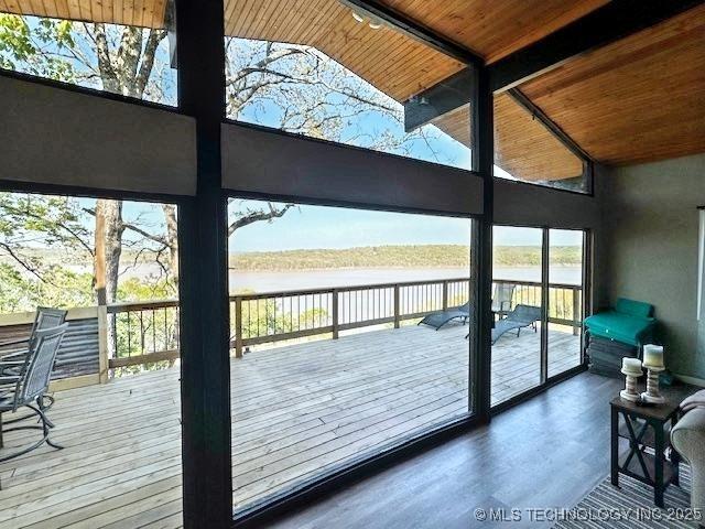 19690 W 892nd Rd, Park Hill, OK 74451 - doorway to outside featuring a water view, a wooden ceiling with exposed beams, wood finished floors, and high vaulted ceiling