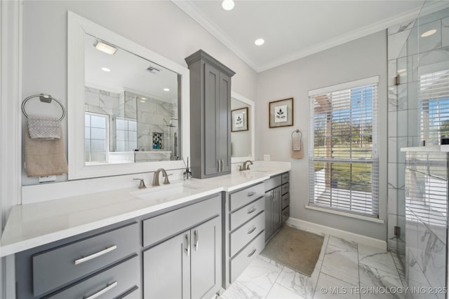 full bath with double vanity, crown molding, a marble finish shower, and a sink