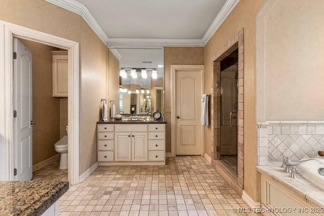 bathroom featuring a shower stall, vanity, toilet, crown molding, and a garden tub
