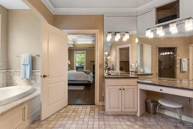 ensuite bathroom featuring a tile shower, ornamental molding, a garden tub, vanity, and ensuite bath