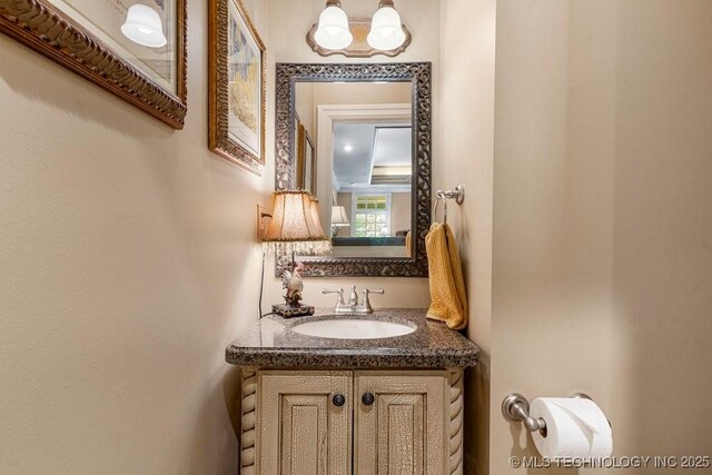 half bath featuring vanity