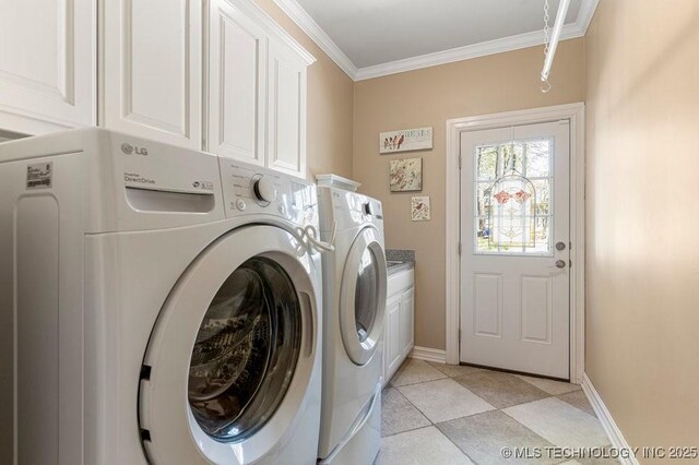 laundry room with ornamental molding, washer and dryer, cabinet space, and baseboards