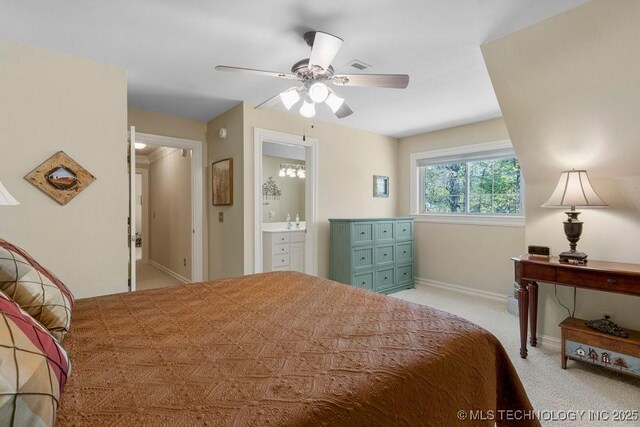 bedroom featuring connected bathroom, visible vents, baseboards, light carpet, and a ceiling fan