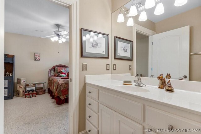 bathroom featuring ceiling fan, vanity, and ensuite bath