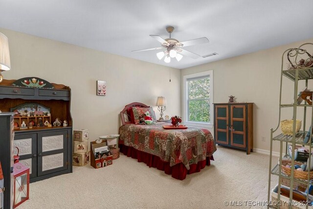 bedroom with visible vents, ceiling fan, and carpet floors