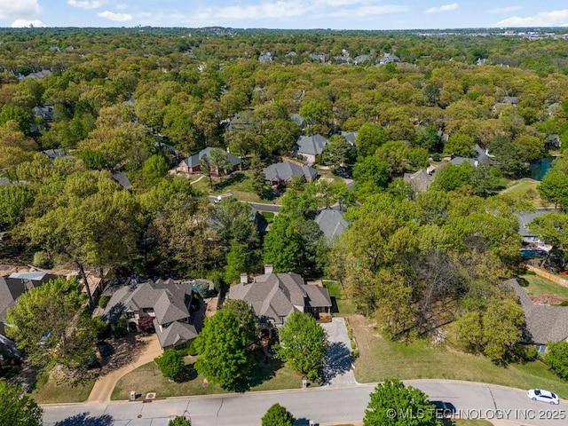 6619 E 114th St S, Bixby, OK 74008 - aerial view of property's location featuring a heavily wooded area and nearby suburban area
