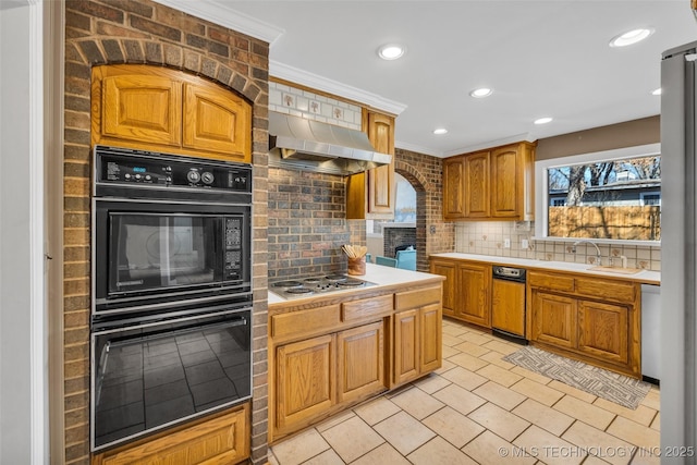 kitchen featuring a sink, extractor fan, stainless steel appliances, backsplash, and recessed lighting