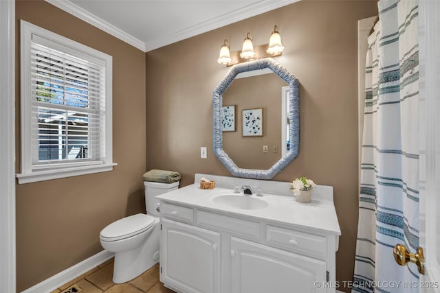 bathroom featuring tile patterned floors, toilet, vanity, crown molding, and baseboards