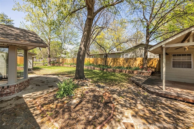 view of yard with a fenced backyard and a deck
