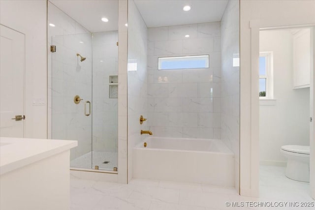 bathroom featuring recessed lighting, a washtub, toilet, vanity, and a stall shower