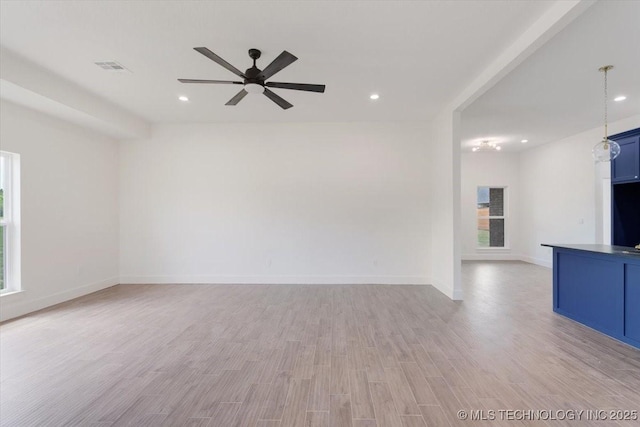 unfurnished living room with light wood-type flooring, baseboards, visible vents, recessed lighting, and a ceiling fan