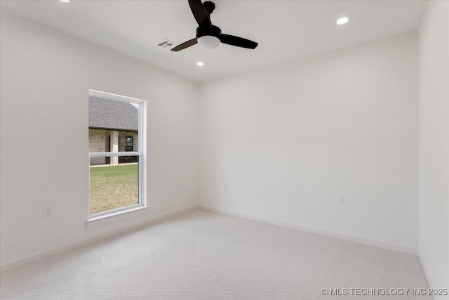 empty room with a ceiling fan, visible vents, carpet floors, and recessed lighting