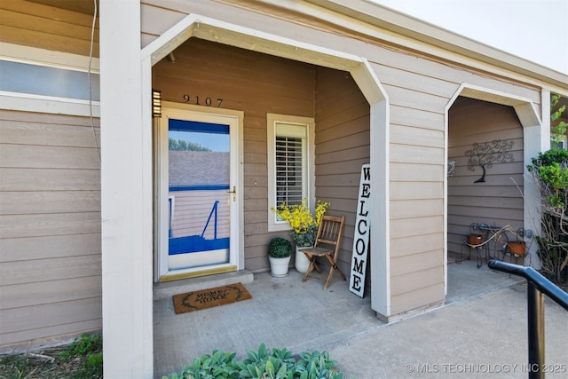 doorway to property featuring a porch
