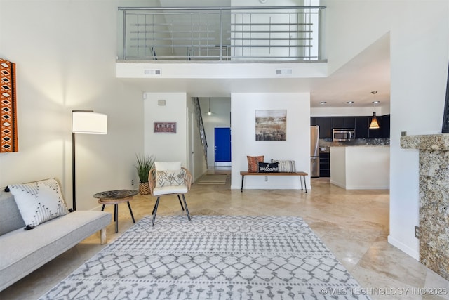 interior space with a high ceiling and visible vents