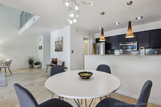 dining space with visible vents and recessed lighting