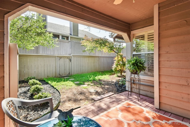 view of patio / terrace featuring fence