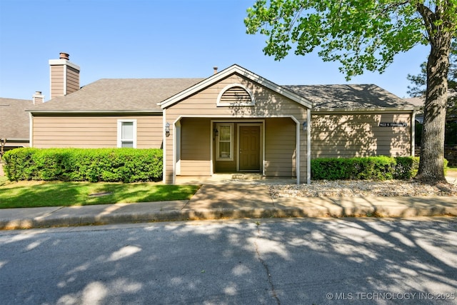 view of front of property featuring a chimney