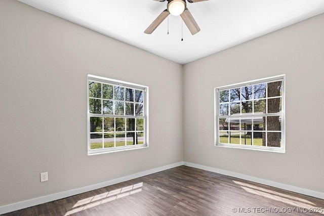 401 S Brewer St, Vinita, OK 74301 - empty room featuring wood finished floors, a wealth of natural light, baseboards, and ceiling fan