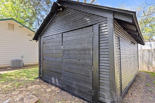 401 S Brewer St, Vinita, OK 74301 - view of outdoor structure with fence, an outbuilding, and central AC