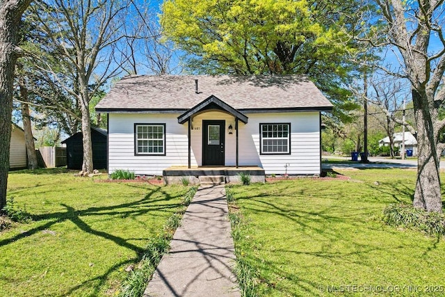 401 S Brewer St, Vinita, OK 74301 - bungalow with roof with shingles, fence, and a front yard