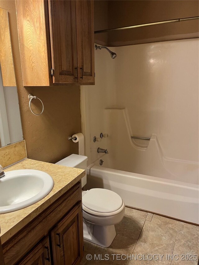 full bathroom with vanity, toilet, and bathtub / shower combination