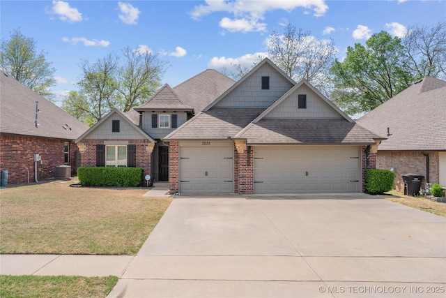 3235 Boardwalk Ct, Bartlesville, OK 74006 - craftsman-style home with concrete driveway, a front lawn, roof with shingles, and an attached garage