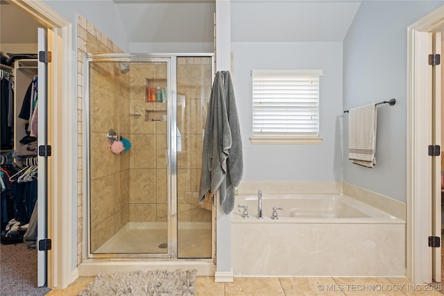 3235 Boardwalk Ct, Bartlesville, OK 74006 - full bath featuring a walk in closet, a shower stall, a garden tub, and tile patterned floors
