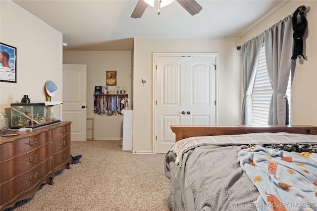 3235 Boardwalk Ct, Bartlesville, OK 74006 - bedroom with baseboards, a ceiling fan, carpet flooring, and a closet