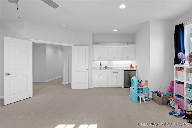 12754 S Irvington Ave, Tulsa, OK 74137 - rec room with light carpet, recessed lighting, ceiling fan, and wet bar
