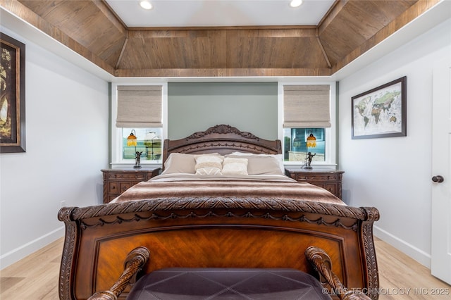 bedroom with light wood finished floors, baseboards, and recessed lighting