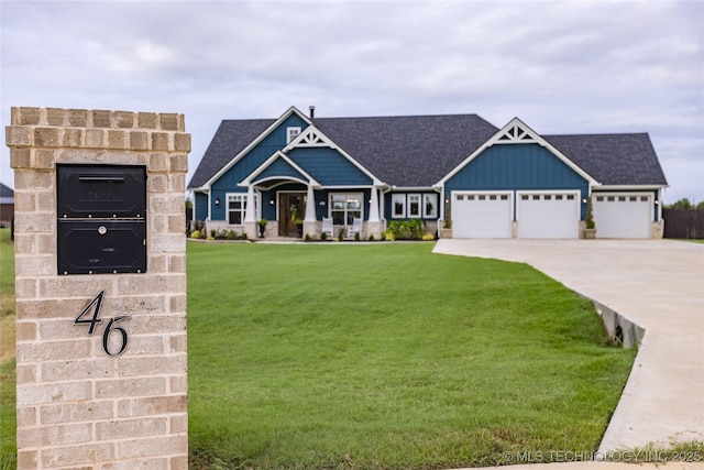 craftsman-style home with a front lawn, board and batten siding, driveway, roof with shingles, and a garage