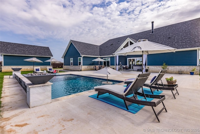 outdoor pool featuring a patio area